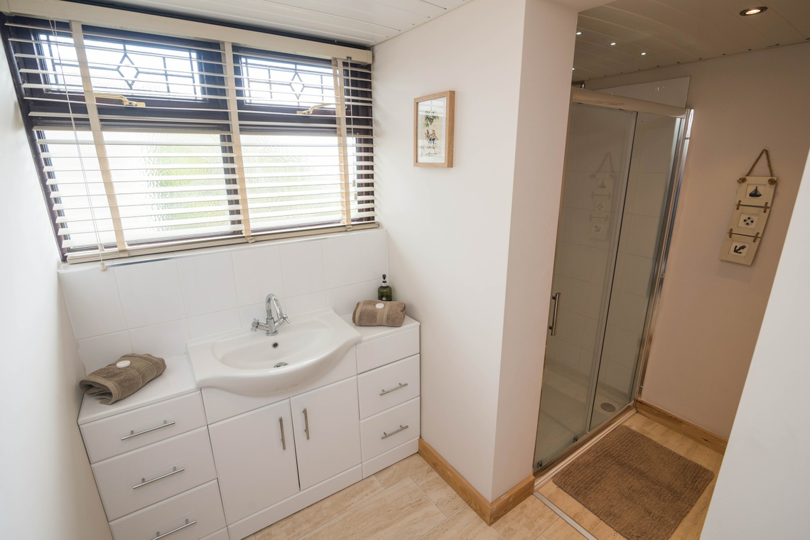 Second bathroom with shower on ground floor.